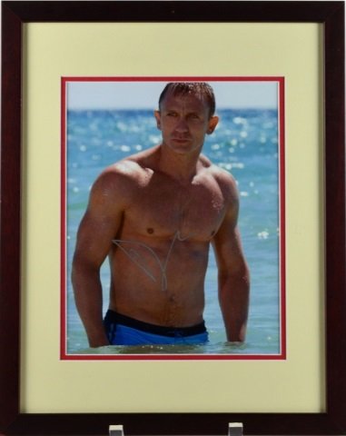 AUTOGRAPH OF JAMES BOND ACTOR DANIEL CRAIG: With letter of authenticity on back. Image size 24.5 x 19 cm. (9.75 x 7.5 in.) Framed: 39 x 38 cm. (15.25 x 12.25 in.)