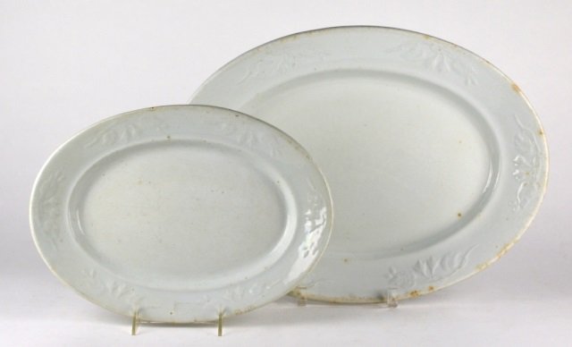 TWO 19TH C. WHITE IRONSTONE PLATTERS: J & G Meakin graduated floral pattern. L of largest: 47 cm. (18 1/2 in.)