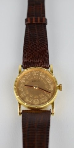 CORUM 18K GOLD ZODIAC WATCH: Swiss made jewel movement on Hirsch band. Astrological signs obverse, Pisces at reverse.