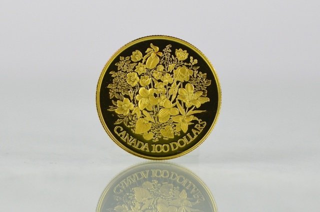 1977 CANADIAN ONE HUNDRED DOLLAR GOLD PROOF COIN: Issued by The Royal Canadian Mint. Queen's Silver Jubilee $100, 22 karat gold coin. Weighs 16.9 grams of which 15.55 grams are fine gold.