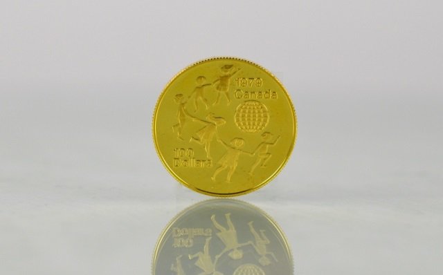 1979 CANADIAN ONE HUNDRED DOLLAR GOLD PROOF COIN: Issued by The Royal Canadian Mint. UNICEF Year of the Child $100, 22 karat gold coin. Weighs 16.9 grams of which 15.55 grams are fine gold.