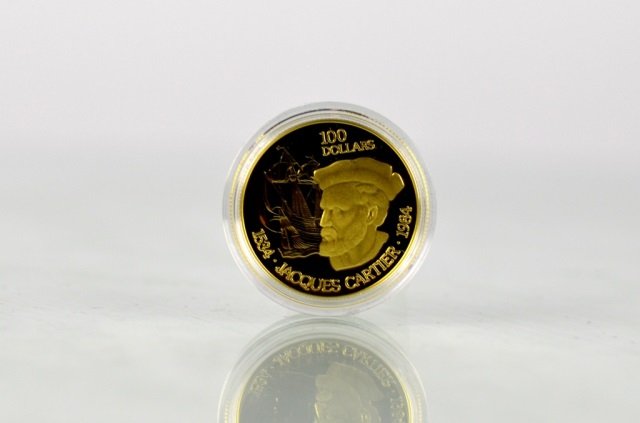 1984 CANADIAN ONE HUNDRED DOLLAR GOLD PROOF COIN: Issued by The Royal Canadian Mint. Jacques Cartier $100, 22 karat gold coin. Weighs 16.9 grams of which 15.55 grams are fine gold.