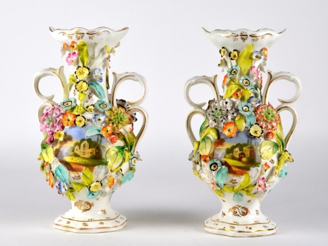 PR 19TH C ENGLISH PORCELAIN FLORAL ENCRUSTED VASES: Double handled with hand painted gilt trim. The British Antique Dealers Association label at base. No marks. H: 23 cm. (9 in.) Loss to flower petals.