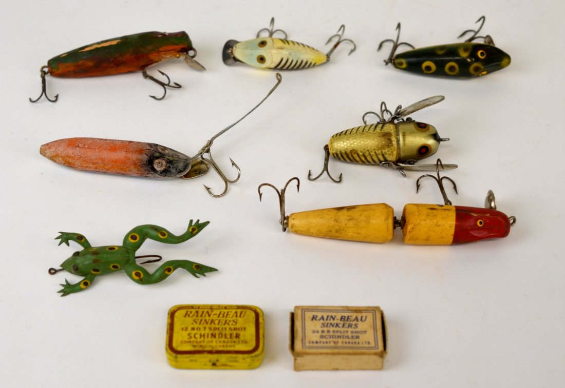 SIX WOODEN FISHING LURES: Including Heddon Crazy Crawler, Midget River Runt. L of longest: 12 cm. (4 3/4 in.)