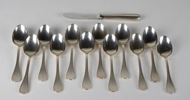 TWELVE CHRISTOFLE SILVER PLATE SPOONS & KNIFE: French silver plate Albi pattern spoons & speader. Marks date 1935-83. L of spoons: 13.5 cm. (5 1/4 in.) L of spreading knife: 16.5 cm. (6 1/2 in.)