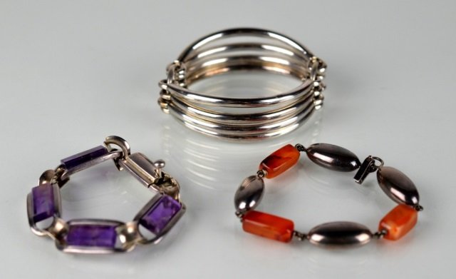 THREE SILVER BRACELETS: Silver bracelet t/w Mexican silver (.925) bracelet with amethyst coloured stones and silver beaded bracelet. Total weight 161 g.