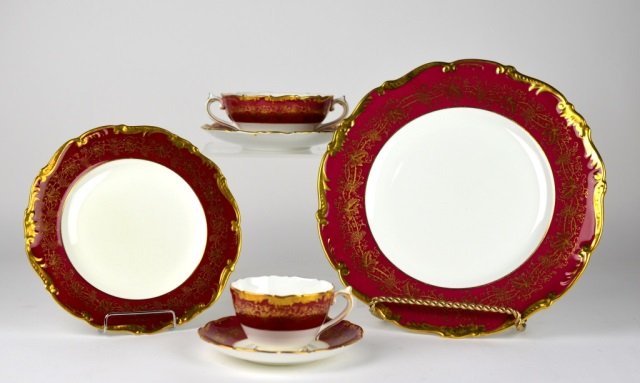 COALPORT HAZELTON PATTERN DINNER SERVICE: Maroon trim decorated with grapevine and gilt trim. 82 pc. set comprised of 22 dinner plates (10 5/8 in.), 20 salad/luncheon plates (7 3/4), 20 sides (6), 8 cream soups with saucers & 12 tea cups with