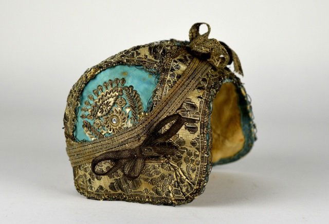 19TH CENTURY CHRISTENING CAP: Hand woven silk with metallic threading and silver decoration. H: 5 1/2 in.