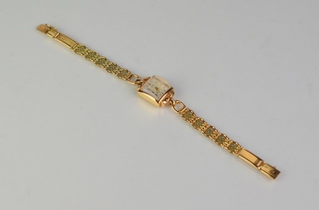 RUSSIAN ANTIQUE GOLD LADIES WRIST WATCH: Back of movement marked .585 for 14k gold, dial 3APR. Two toned rose and yellow gold band with Soviet 583 mark.