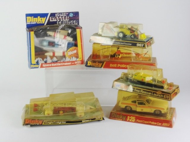 SIX DINKY TOYS VEHICLES: Lot includes Space Battle Cruiser (#367), Eagle Freighter (#360), Bell Police Helicopter (#732), Air Sea Rescue Launch (#678), Ford Capri Police Car (#2253) and a Muir Hill Loader and Trailer (#967). 