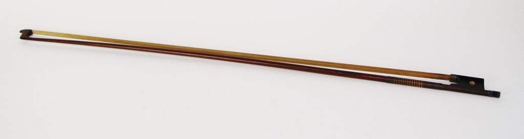 TOURTE VIOLIN BOW: With original horse hair. stamped Tourte, also signed Hoog. Frog having pearl eye with ebony adjuster. Length 73.5cm (29 in.).