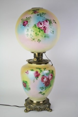 19TH CENTURY GONE WITH THE WIND OIL LAMP: With original hand painted globe shade. Made in the U.S. and electrified. Ht. 68.5 cm. (27")