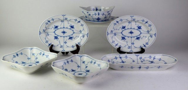 ROYAL COPENHAGEN BLUE FLUTED PLAIN PORCELAIN: Lot comprised of 6 servers. One oblong dish (L: 14 3/4 in.), pair of ovoid platters (10), pair of squared servers (10) and sauce boat with attached under plate (10).