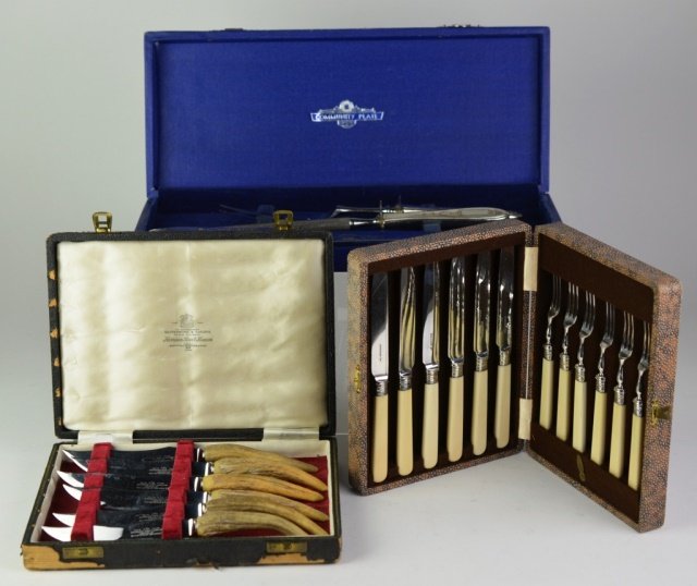 SILVER AND SILVER PLATE FLATWARE: Walker & Hall three tine fork & knife set with silver collars and bone handles, Sheffield cased set of horn handled steak knives and cased silver plate three piece carving set.