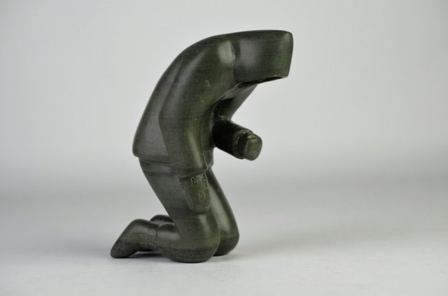 INUIT SOAPSTONE CARVING OF A HUNTER: INUIT SOAPSTONE CARVING OF A HUNTER Marks for MOSES ECHALOOK (b. 1931) Inukjuak. Signed in syllabics. H: 8 in