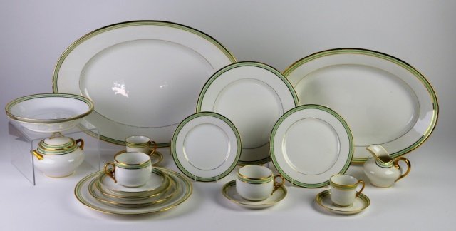 FRENCH PORCELAIN DINNERWARE: Large collection of Limoges dinnerware designed with Greek key banding in green with gilt trim on ivory ground.47 Piece set having a green open key banding with gilt trim on white ground. Comprised of