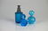 THREE BLUE GLASS VANITY BOTTLES