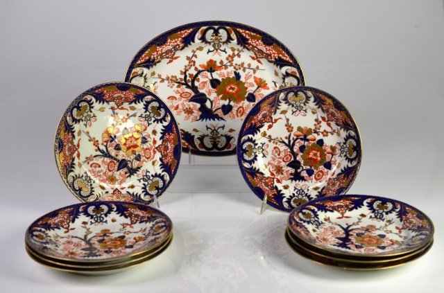 NINE PIECES OF DERBY PORCELAIN DINNERWARE: In the Imari palette. Including 8 plates and matched platter. Late 19th C. D of plate: 8 3/4 in (22.3 cm.)