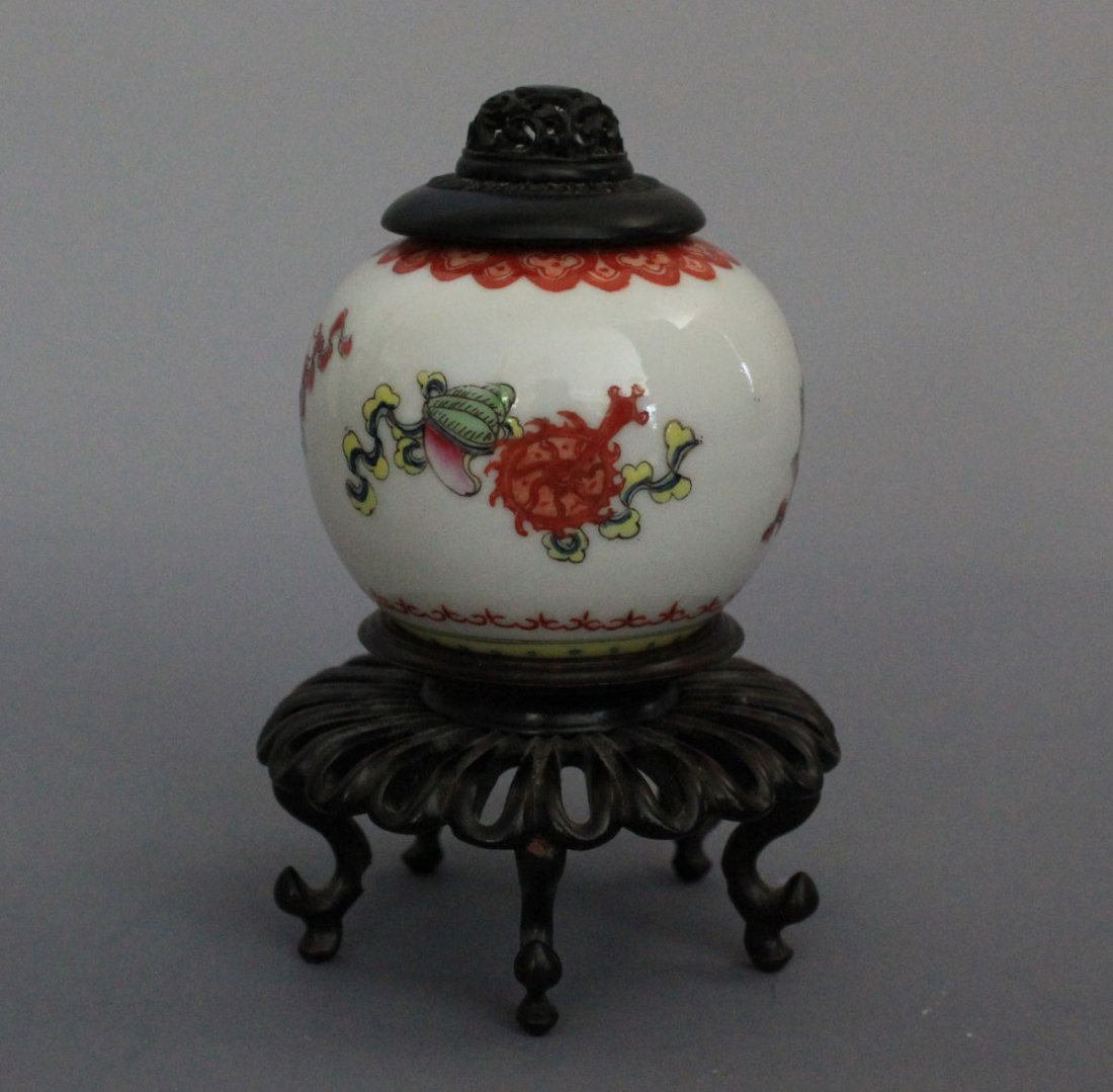 A Chinese Famille Rose Scholar Water Coupe. Republic: Thinly potted and elaborately decorated with Buddhist emblems in famille rose enamel, below a band of ruyi head in iron red on the mouth rim. With nicely carved hardwood stand and lid. The base bears 