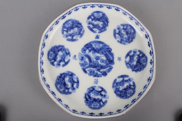 An Imperial Bleu de Hue Octagonal Chinese Blue and: Of typical octagonal form favored by the Thieu Tri King with eight roundels of dragon in cloud on each side, centered by a larger one within a four characters imperial reign mark Thieu Tri nien tao an