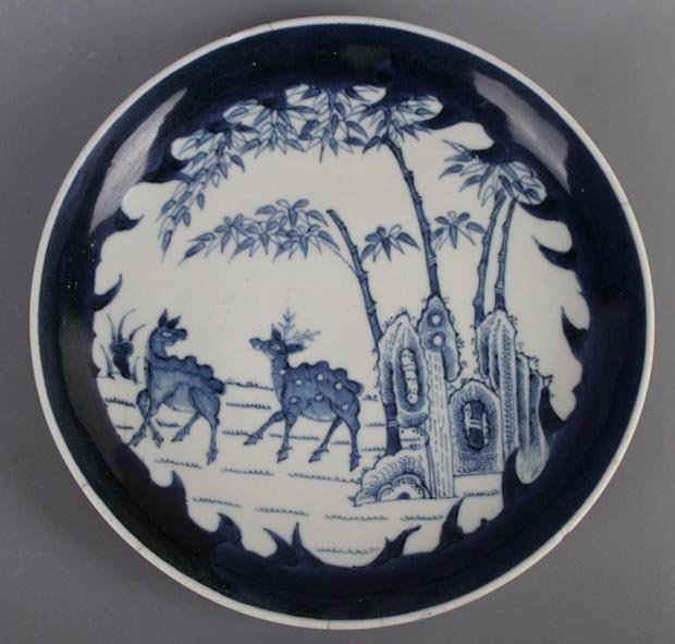 A Chinese Blue and White Blue de Hue Plate. Rare Mark.: Depicting two deer in open landscape with rock, bamboo and lingzhi fungus. With broad, unglazed footrim typical of the Blue de Hue genre (commissioned by the Vietnamese court). The base displays a rar