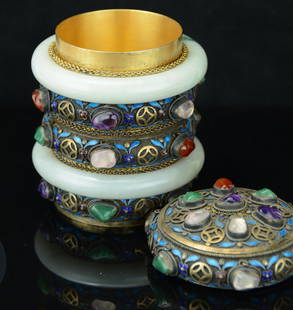 A Chinese Enameled and Inlaid Silver Jewelry Box.: The ribbed cylindrical body decorated with two jadeite jade bangles alternating with bands of cloisonne flowers over silver, further inlaid with cabochons of semi precious stone including jadeite, ros