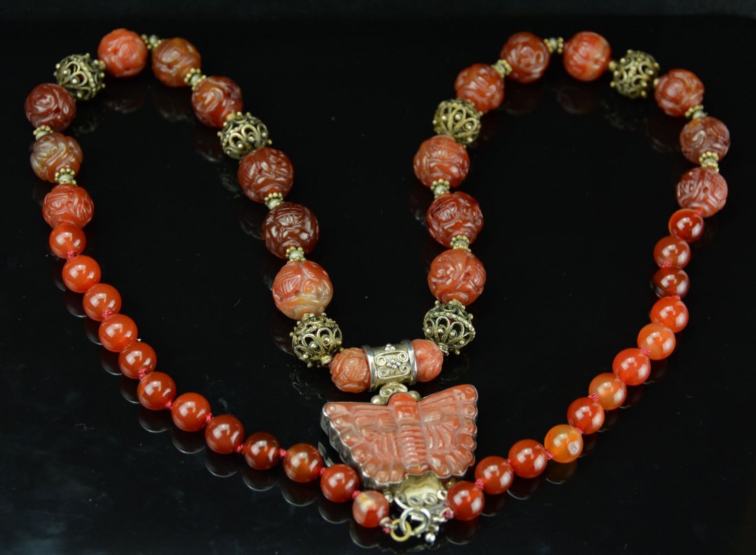 A Chinese Carnelian Beads Necklace, Late Qing to Minguo: Carnelian Carved Chinese Character "壽" and other pattern Plus a Butterfly Pendant. 41cm(16in) 瑪瑙刻壽字紋珠子以及銅鏤&#x