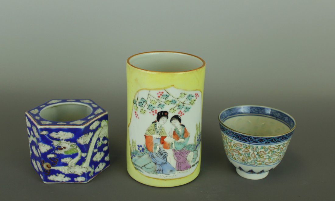 A Group of Chinese Famille Rose Porcelain.: The first a hexagonal cup warmer, decorated with white dragon and clouds motifs on a blue background, the flat base bears a Tongzhi (1862-1875) reign mark in coral red and of the period. The second a 