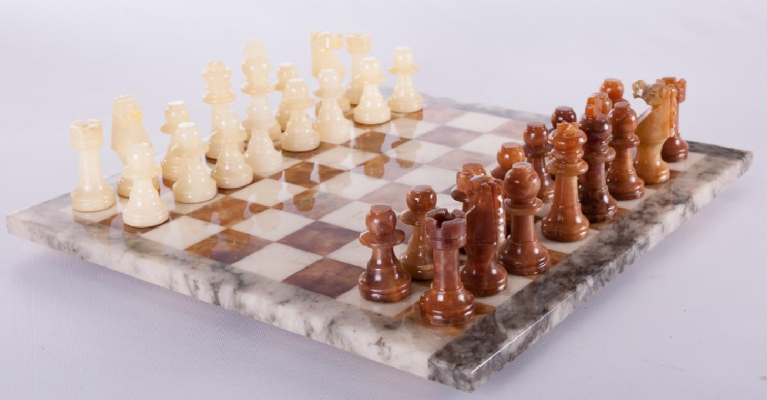 Carved Stone Chess Set: Carved stone chess set, contains board and pieces; measures approximately 14-3/4" square. Note: off-white side bishops are absent, but have two additional pawns.