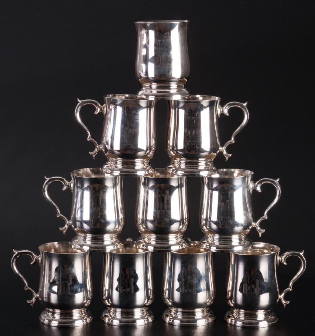 Williamsburg Lenox Pewter Tankards Group: Set of ten Williamsburg tankards by Lenox, crafted in easy care pewter; one with broken handle, measure approximately 4-3/4" high and 3-1/2" in diameter to the base, each. Marked.
