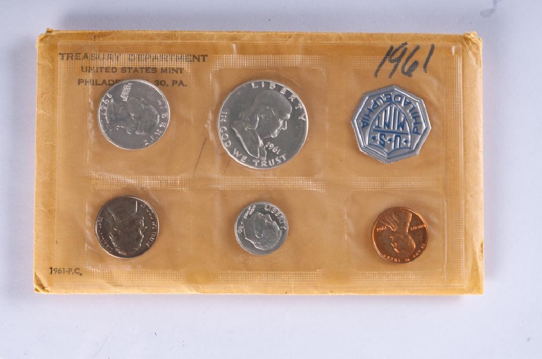 1961 Proof Set: Includes(1) quarter (1) dime (1) nickel (1) penny and (1) Franklin half dollar.
