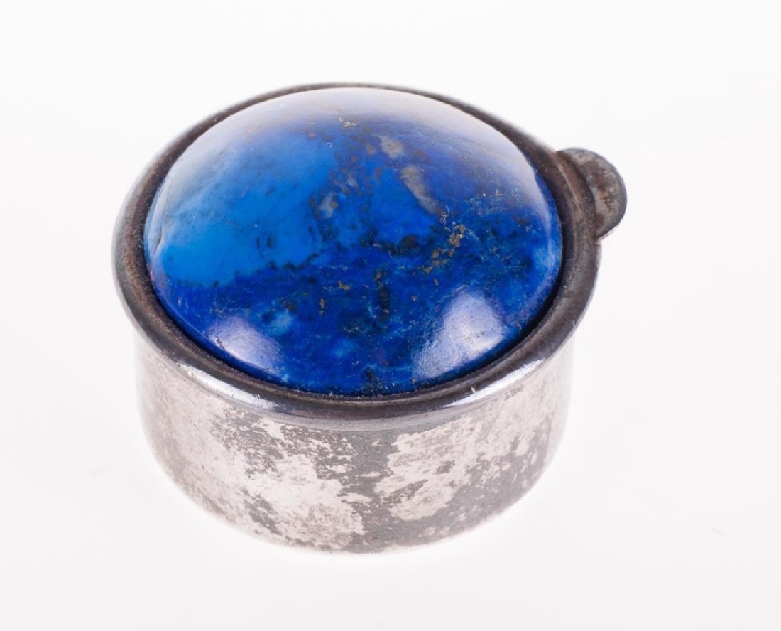 Lapis Top Silver 925 Pillbox: Silver pillbox with silver and lapis top. Marked "925" to the bottom. Pillbox measures approximately 3/4" in height with a base diameter of approximately 1". In overall good condition consistent with 