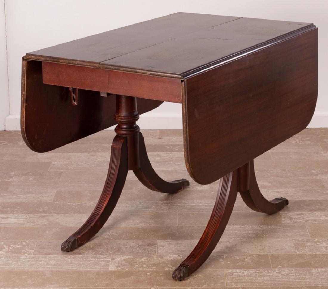 Brandt Duncan Phyfe Style Drop Leaf Table: Brandt mahogany drop leaf Duncan Phyfe style table resting on brass paw capped feet, includes two leaves and custom pads; measures approximately 28-3/4” high, 38-7/8” wide and 24” long, each dro