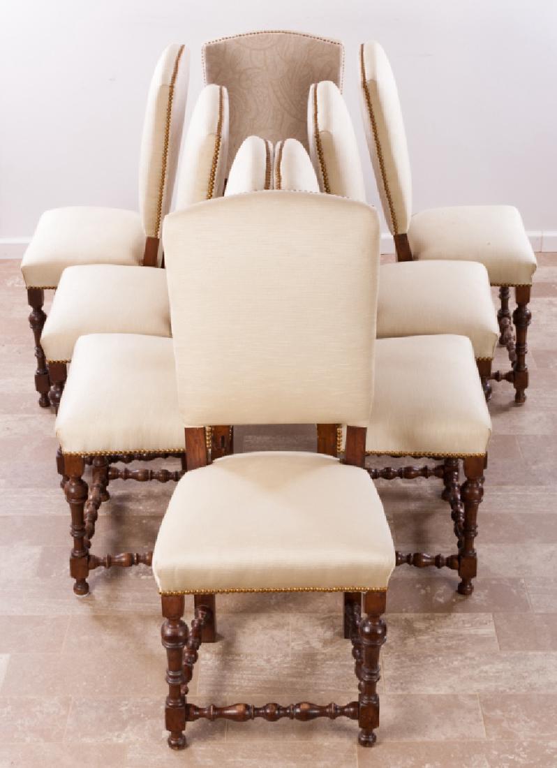 Jacobean Style Dining Chairs Set of Eight: Set of eight Jacobean style dining chairs, carved wood with beige-colored upholstery and nail head accents, to include: two armchairs and six side chairs, measures approximately 42-1/2" high, 19" wide
