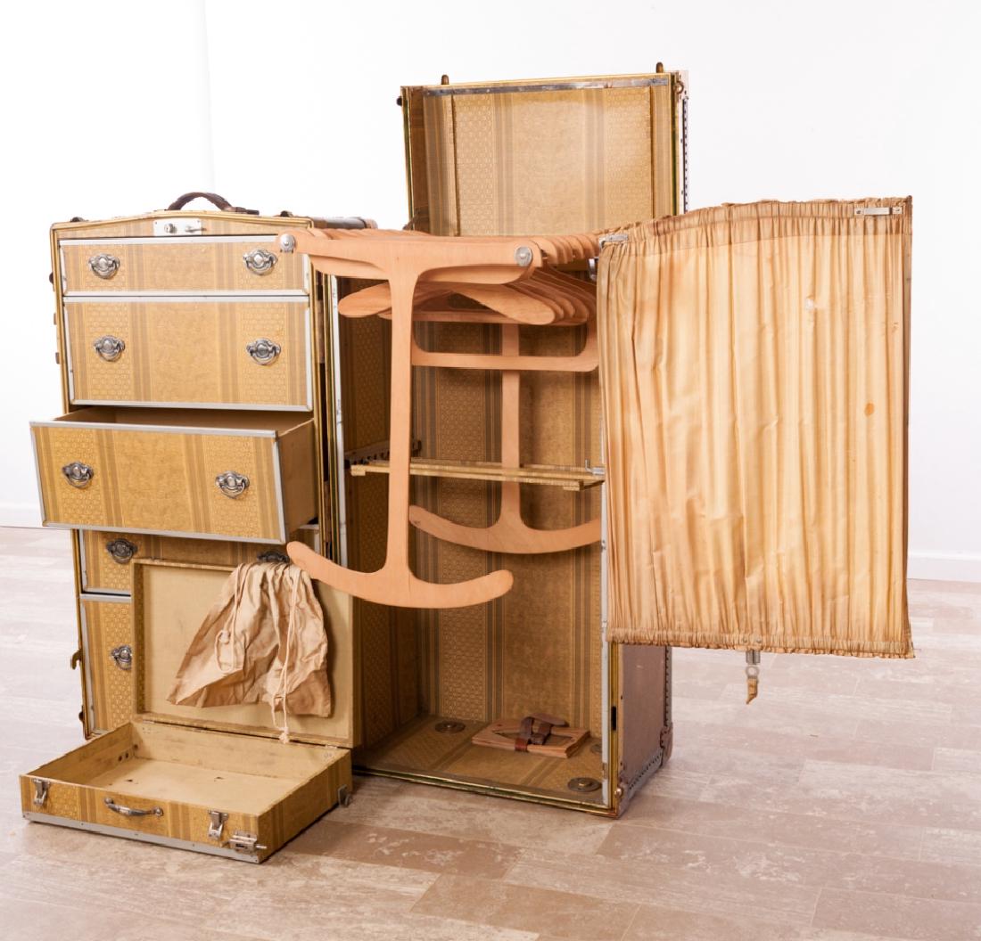 Mendel Trunx Steamer Trunk No. 168451: Mendel Trunx steamer trunk opening to five (5) drawers to one side with hangers and additional matching case to the other; measures approximately 41-1/4” high, 25-1/2” wide and 22-1/2” in depth.