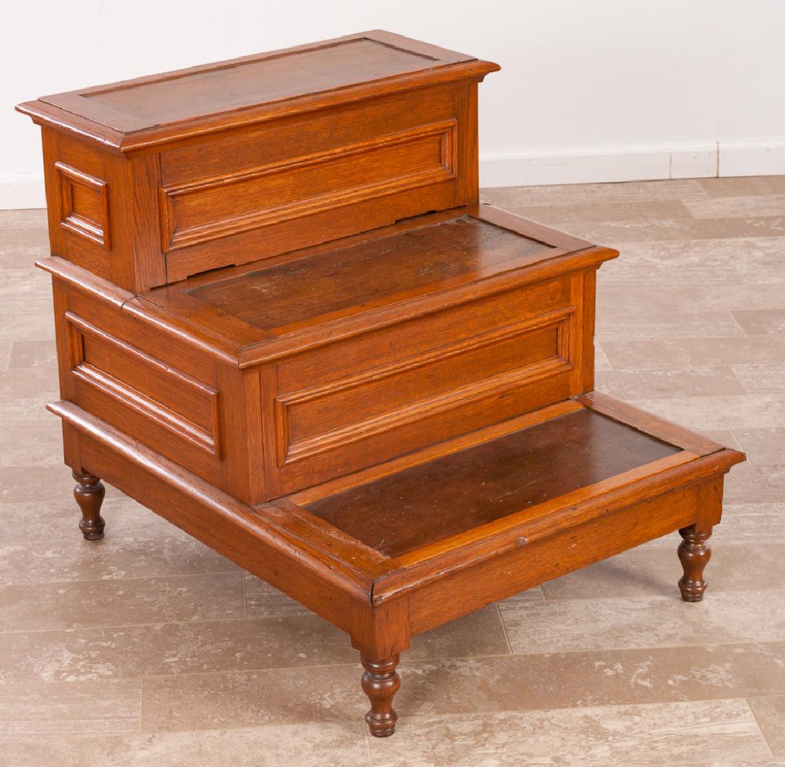 British Oak Bed Steps & Commode Circa 1800s: Oak 19th Century British combination commode and bed steps, top hinged step opening to a vacant interior, middle step pulls out and opens for placement of a chamber pot; measures approximately 26-3/4�