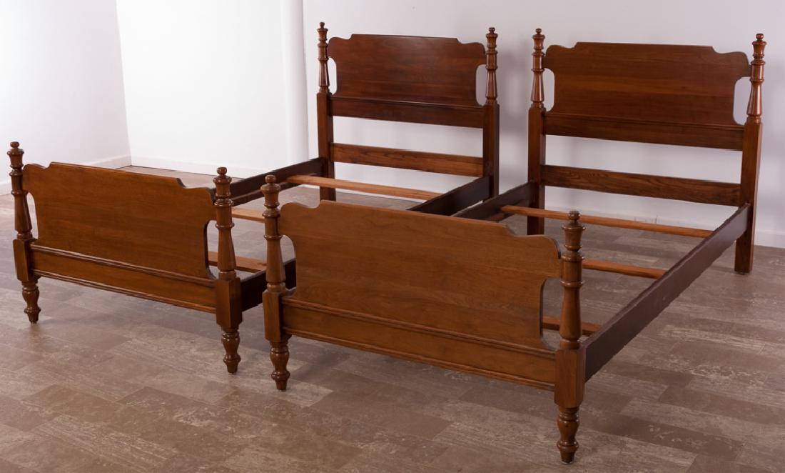 Davis Cabinet Company Walnut Twin Beds Pair: Pair of Davis Cabinet Company Woodstock Walnut twin beds, having solid wood headboards, footboards and side rails; measures approximately 41-1/2" high, 39" wide (inside rail to inside rail), 42" wide