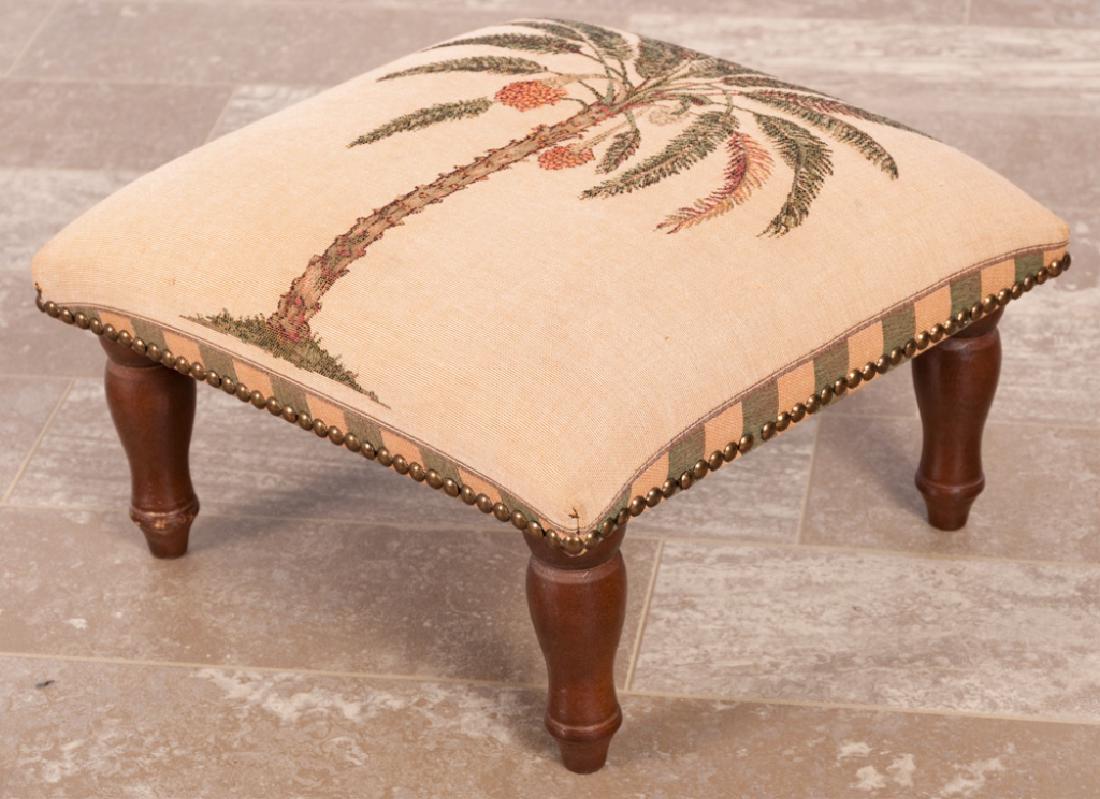 Iosis French Footstool: Palm tree motif Iosis French footstool with nail head trim; measures approximately 8-1/2” high, 14-1/2” in width and 14-1/2” in depth. “Iosis, Paris, Made in France” label to the bottom.