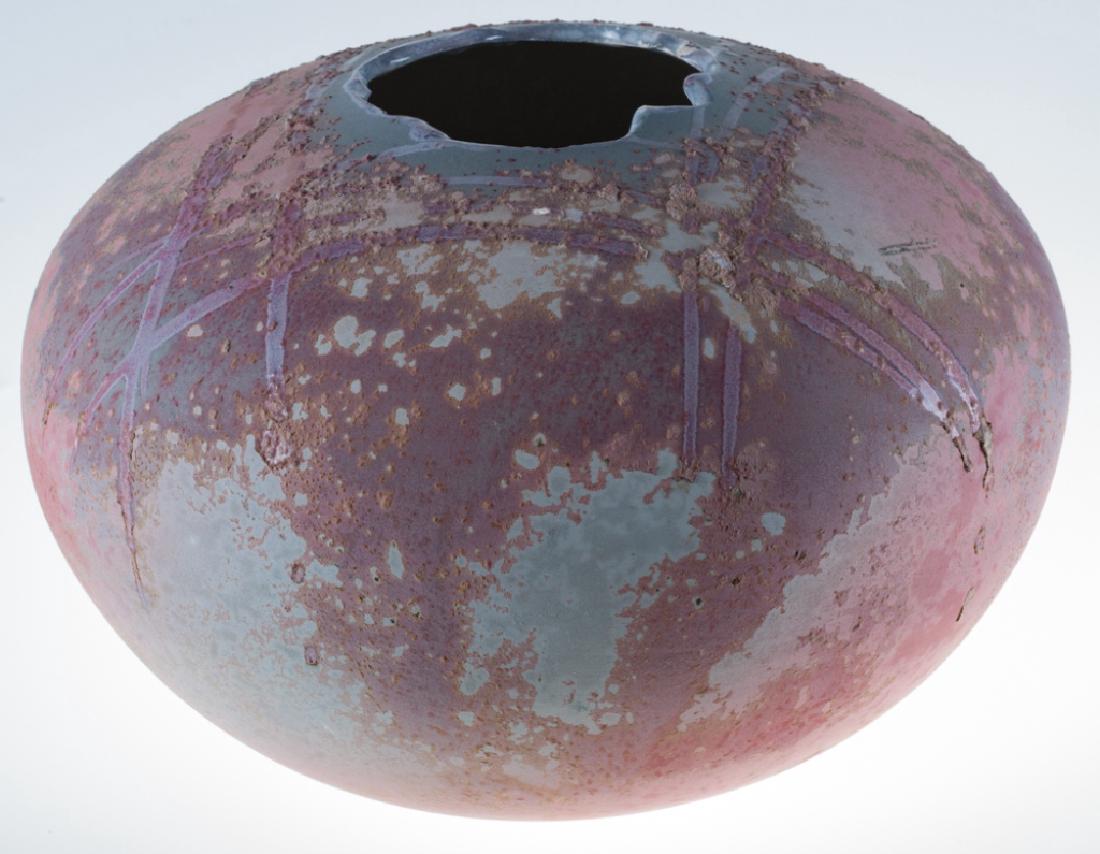 Tony Evans Raku Pottery Vessel: Raku pottery vessel by noted California ceramic artist Tony Evans; measures approximately 8-3/8” high and 12” in diameter. Signed and numbered to bottom.