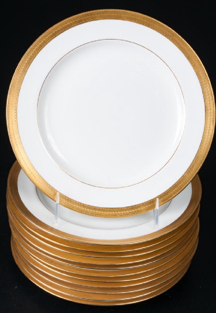 Mintons Dinner Plates, Set of Twelve (12): Set of twelve (12) Mintons dinner plates with applied gilt rims measuring approximately 10-1/4" in diameter. Marked to bottom.