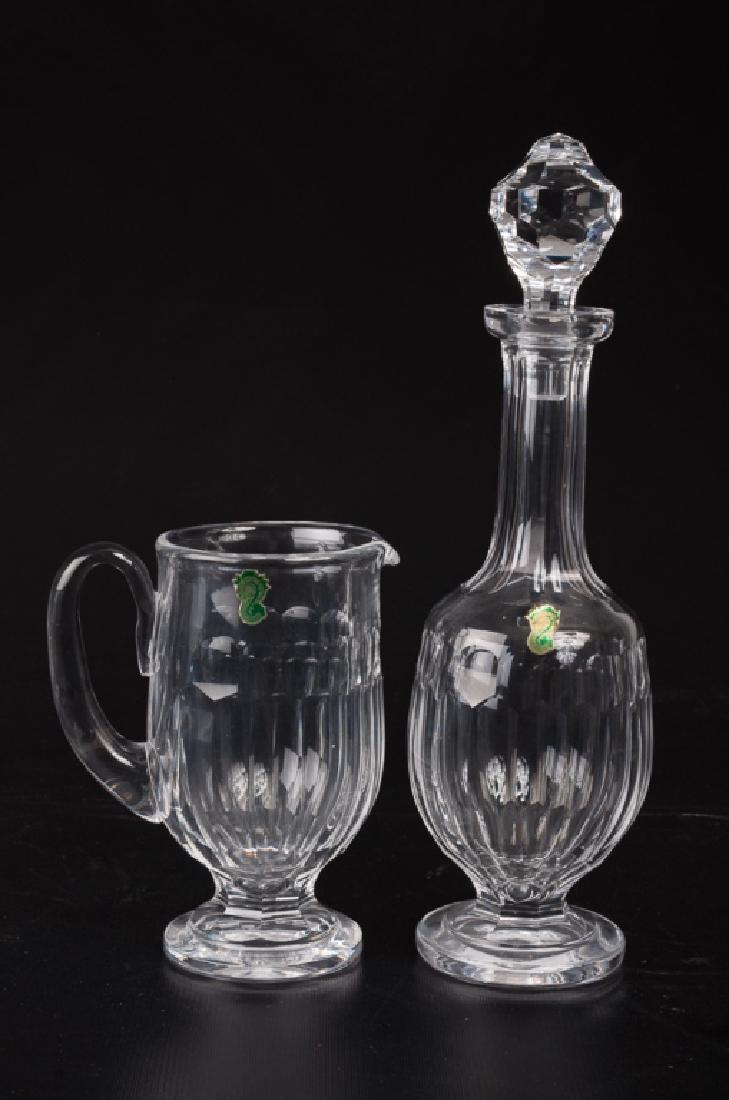 Waterford Crystal Decanter & Pitcher: Waterford hand cut crystal decanter and pitcher; decanter measures 14-3/4” high. Both marked with paper labels.