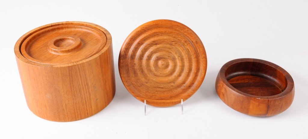 Dansk Teak Treenware Trio: Dansk International Designs Ltd teak treenware trio to include: One (1) lidded ice bucket with plastic lining, one (1) 7-1/2” diameter bowl, and one (1) round 8-3/4” diameter concentric circles tr
