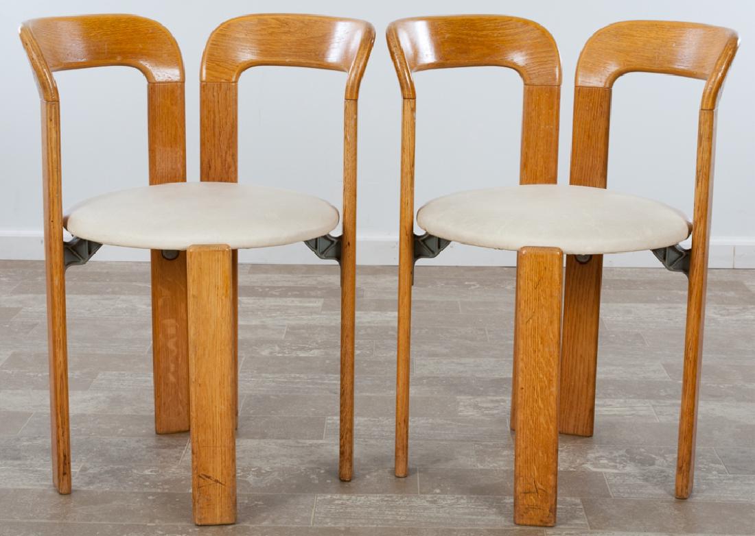 Bruno Rey for Stendig Armchairs Pair: Pair of Bruno Rey for Stendig armchairs, each with oak frames, metal support brackets, and upholstered seats, made in Switzerland; chairs measure approximately 29-1/2” high by 21-3/4” wide, with a