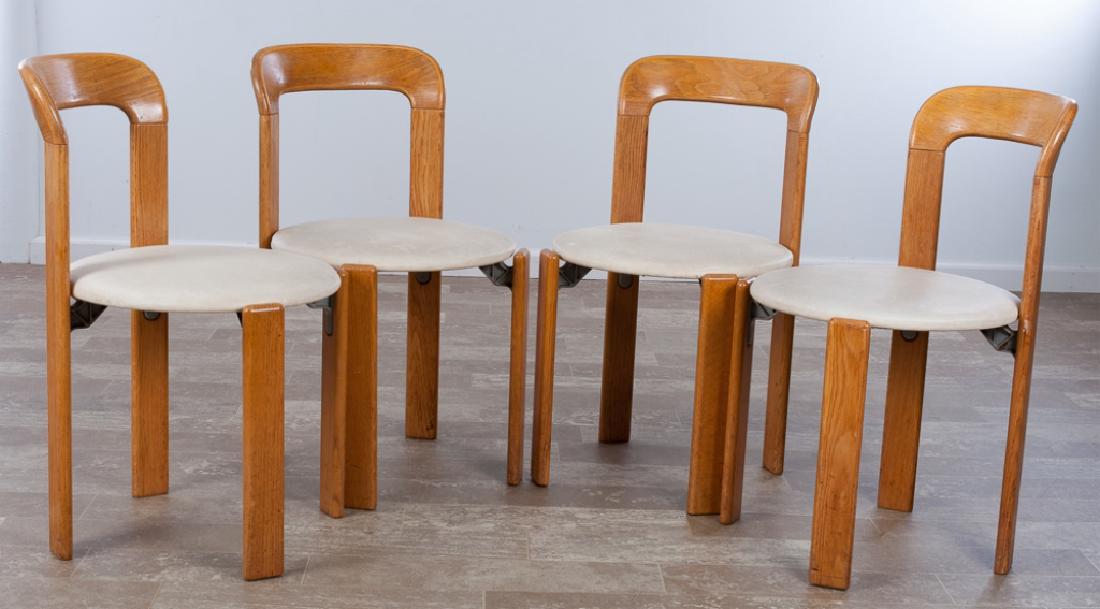 Bruno Rey for Stendig Side Chairs Group: Group of four (4) Bruno Rey for Stendig side chairs, each with oak frames, metal support brackets, and upholstered seats, made in Switzerland; chairs measure approximately 30-1/2” high by 17-1/2”