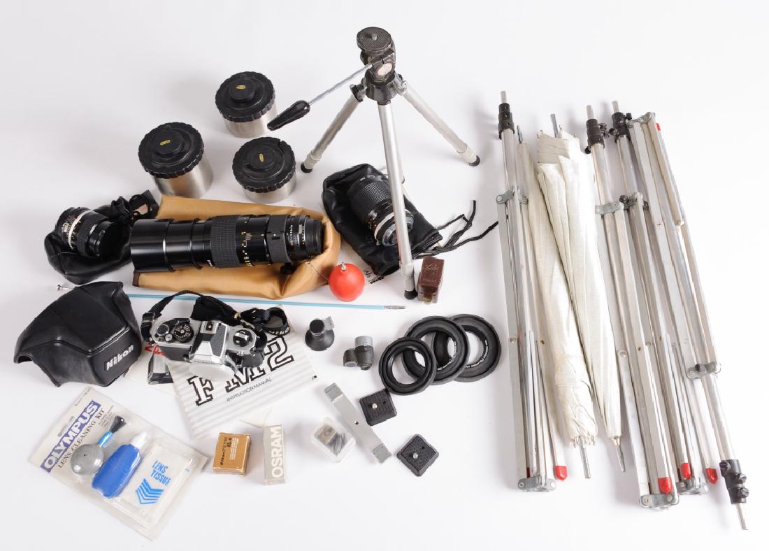 Nikon FM2 Camera & Accessories: Nikon FM2 35mm camera and accessories to include: Nikon FM2 35mm camera with instruction manual, information booklet, and partial protective case; Nikon 300mm f4.5 72mm manual focus telephoto lens wit