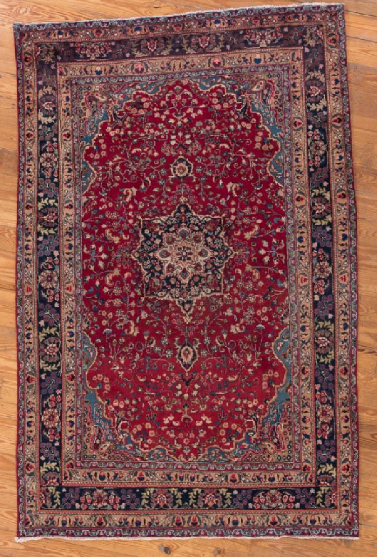 Antique Iranian Mashad 6'3" x 9'7" Rug: Antique Mashhad made in Iran with a wine colored field and a multicolored triple banded border and a blue accented center medallion; handmade and hand-knotted 100% wool pile oriental rug. Measures app