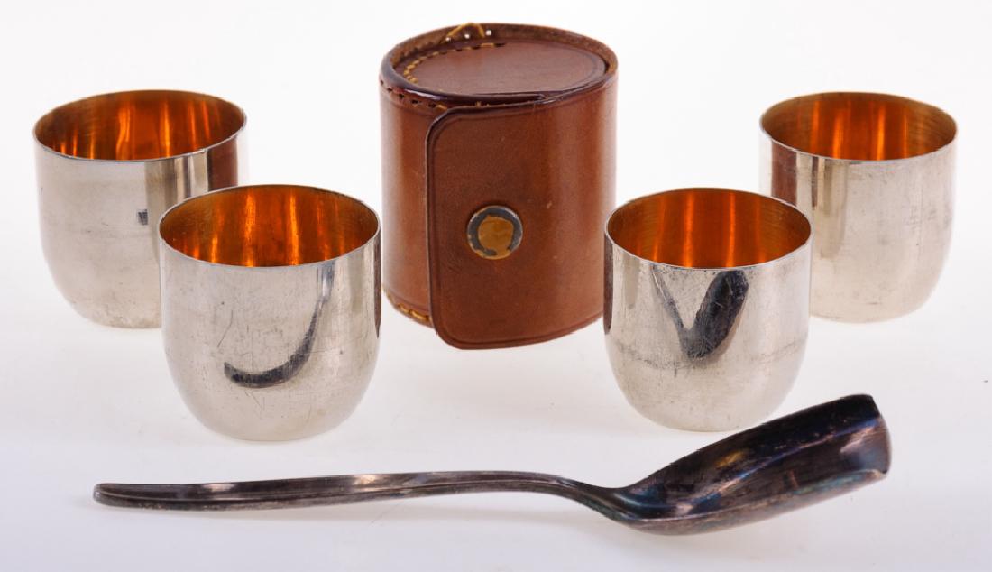 German Travel Shot Glass Set & WMF Sugar Spoon: Vintage German with sugar spoon marked to back "WMF 90 1.5" (signifying silverplate) and measuring in length 4-3/4" with width of 1". The German travel shot glass set is encased in a custom leather ca