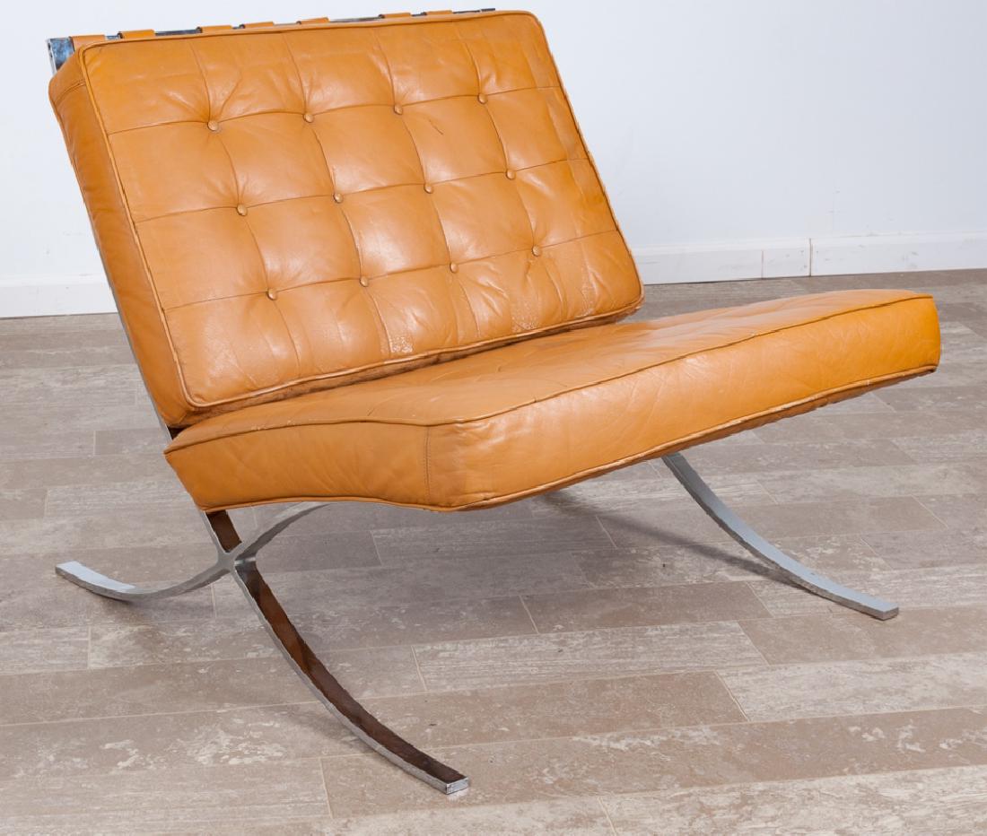 Barcelona Lounge Chair: In the manner of Ludwig Mies van der Rohe's "X" frame constructed chair with camel colored leather button tufted seat and backrest; measures approximately 28-3/4" high, 31" wide with a seat depth of 2
