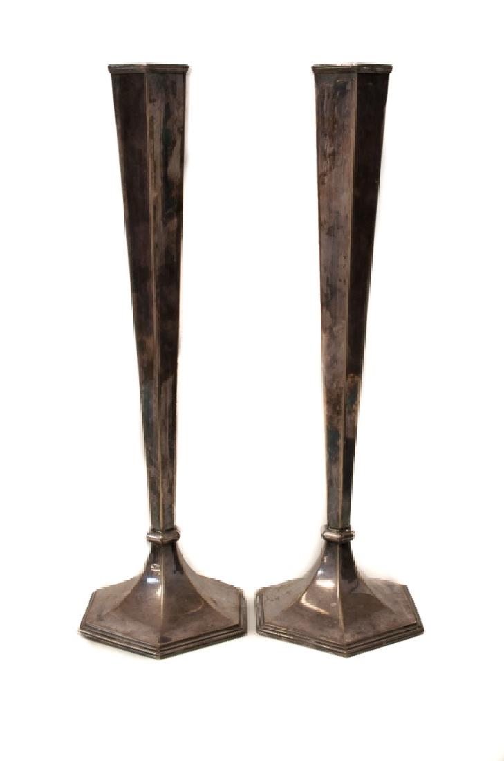 Sheffield Silver Plated Trumpet Vases Pair: Pair of early 20th century Sheffield silver plated trumpet vases having panel designs and reeded edges to top and foot rims; each measure approximately 17" in height.