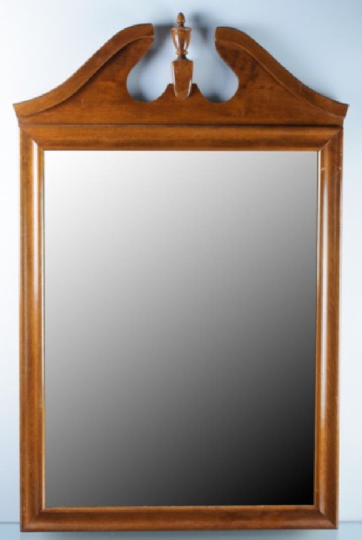 Ethan Allen Chippendale Style Wall Mirror: Wall mirror having a molded wood frame and a broken pediment with center urn finial to the top by Ethan Allen. Marked Ethan Allen to the back. Measures approximately 36-3/4â€ high, and 22-3/4â€